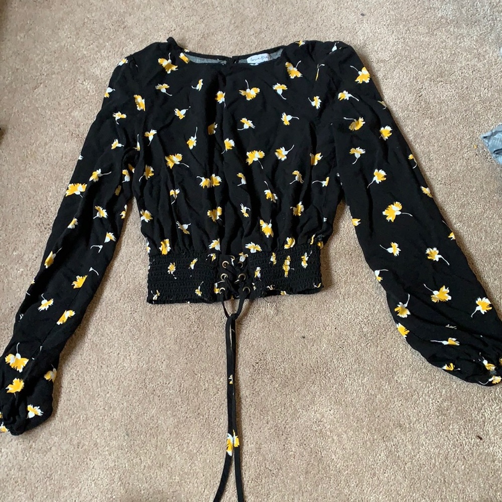 black frilly crop top shirt with flowers on it